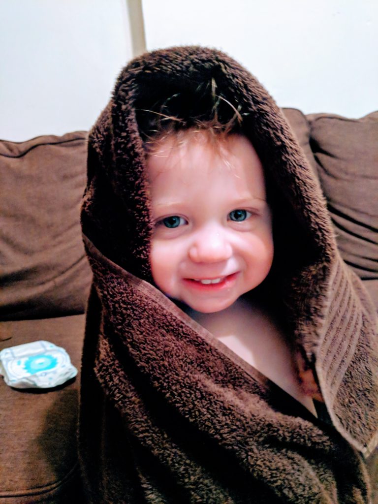 toddler wrapped in towel