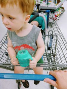 autistic toddler and young baby in shopping cart