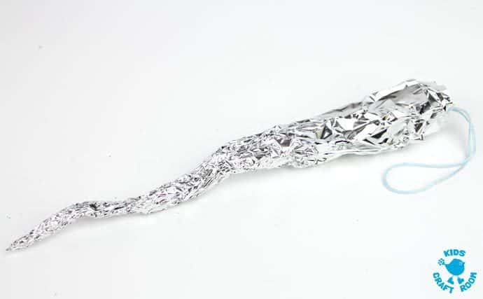 icicle made out of aluminum foil for a sensory toddler craft
