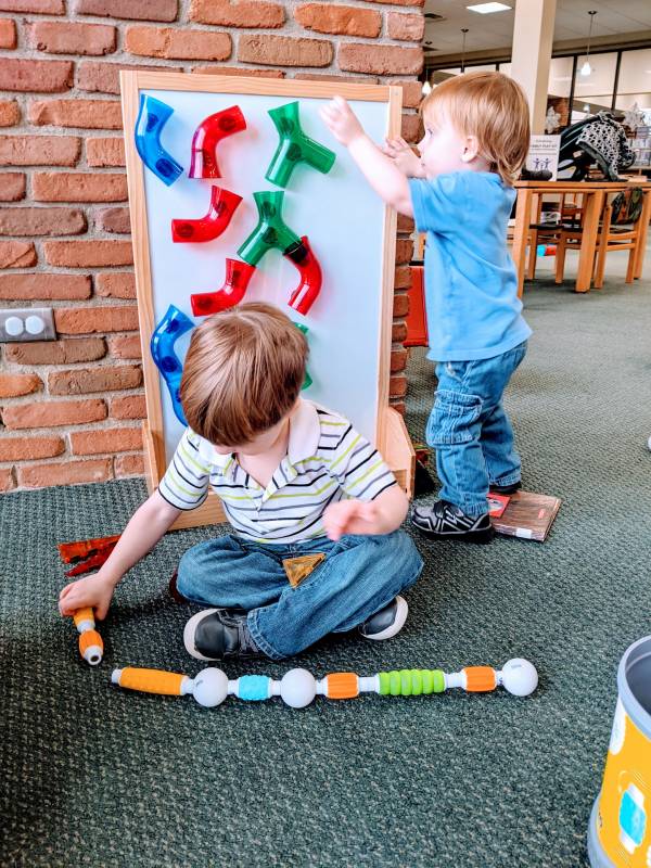 toddler and preschooler enjoying Morrisson Reeves library