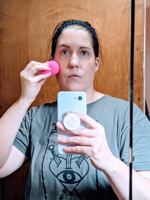 Applying foundation with the original beauty blender