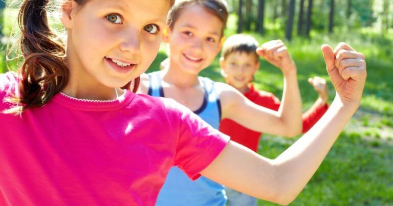 stock image of kids flexing arms to show strength